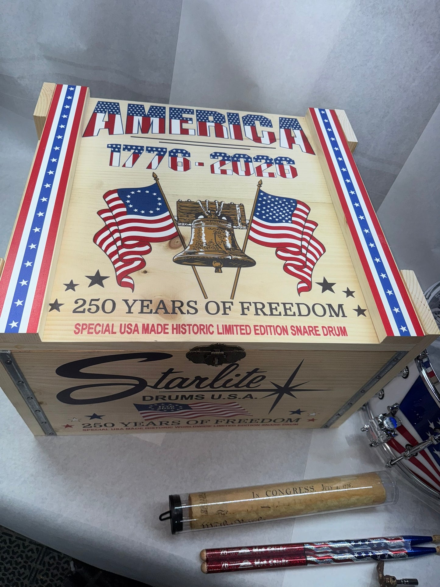 RCI Starlite 250th Anniversary commemorative box lid with drumsticks and documents