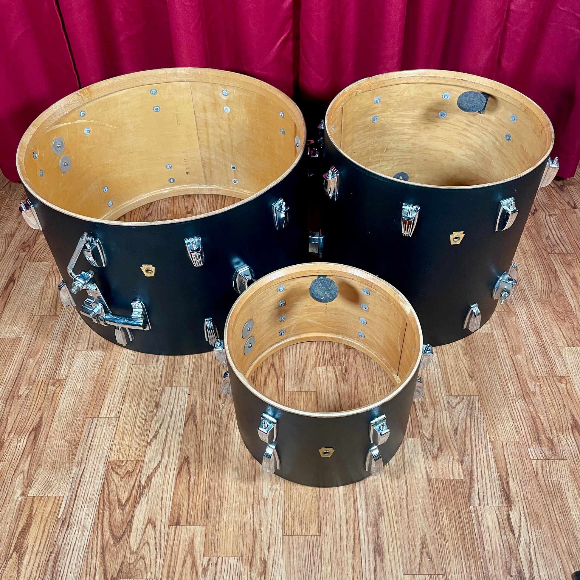 Interior view of all three drum shells with heads removed, showing the maple wood shell construction