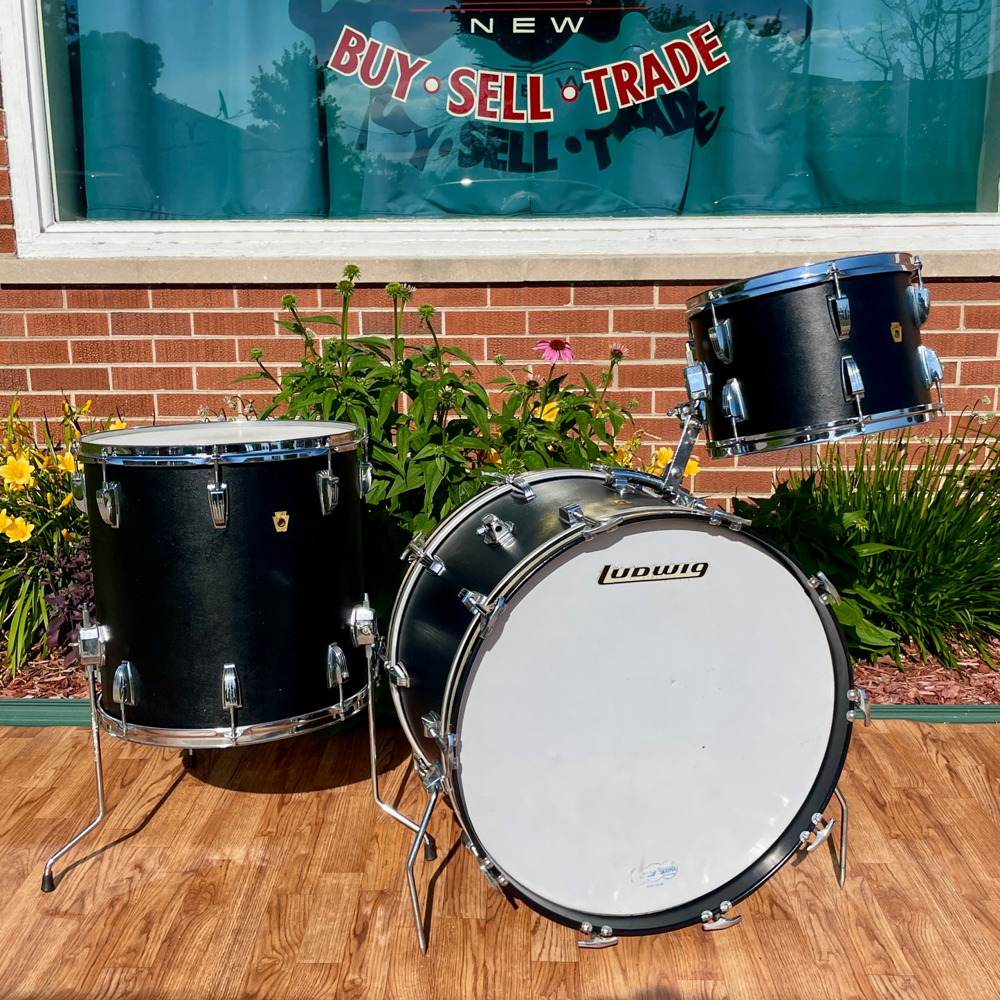 Ludwig Super Classic drum set outside the shop, front view showing the Ludwig script logo on the bass drum head