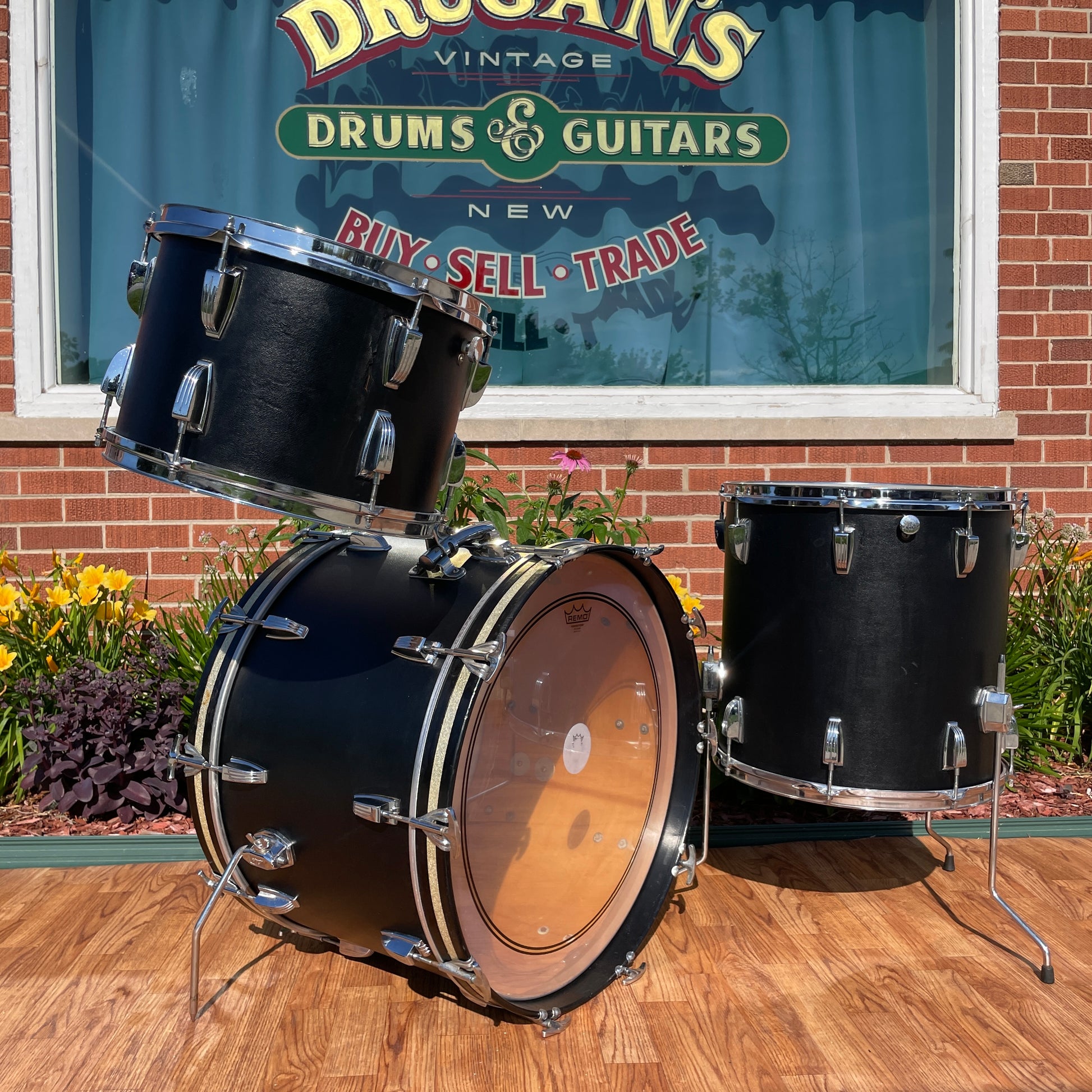 Ludwig Super Classic drum set displayed outside Drugan's Vintage Drums and Guitars with the full storefront sign visible
